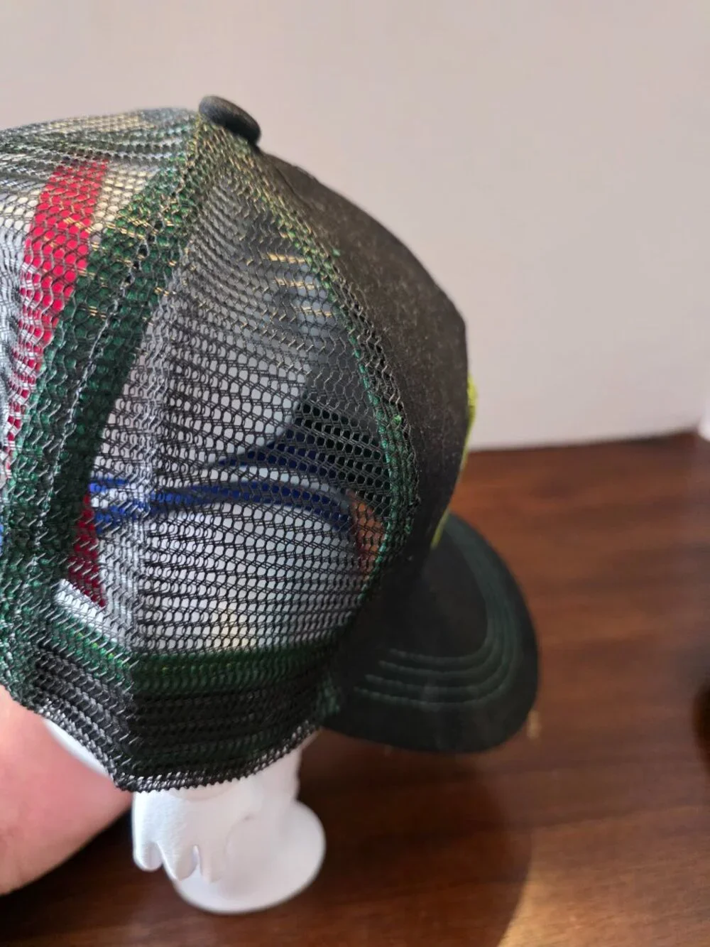 Marvel Comics snapback cap features a black mesh back